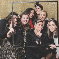 Bride and girls with fake cigarette at Photobooth. Great Gatsby Bridal Shower. Bridesmaidsconfession.com